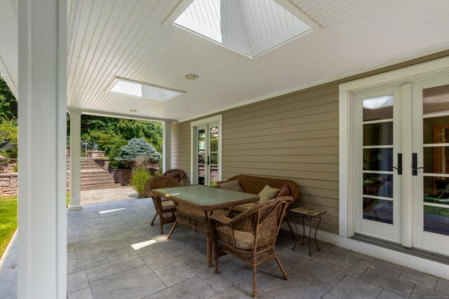 607 Tolland Stage Rd, Tolland, CT 06084 - sunroom featuring french doors, outdoor dining area, and a skylight