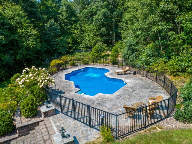 607 Tolland Stage Rd, Tolland, CT 06084 - view of pool with a patio area and a wooded view