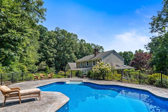 607 Tolland Stage Rd, Tolland, CT 06084 - view of swimming pool with view of scattered trees and a patio