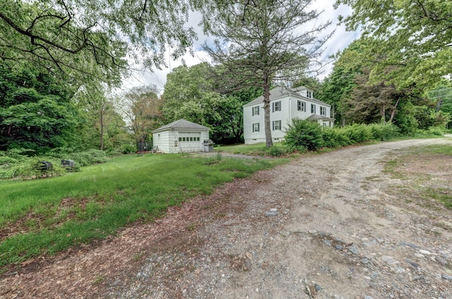 9 Jennings St, Griswold, CT 06351 - view of yard with driveway, a garage, an outdoor structure, and a forest view