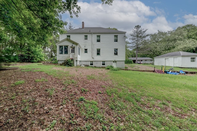9 Jennings St, Griswold, CT 06351 - rear view of house featuring a chimney and a yard