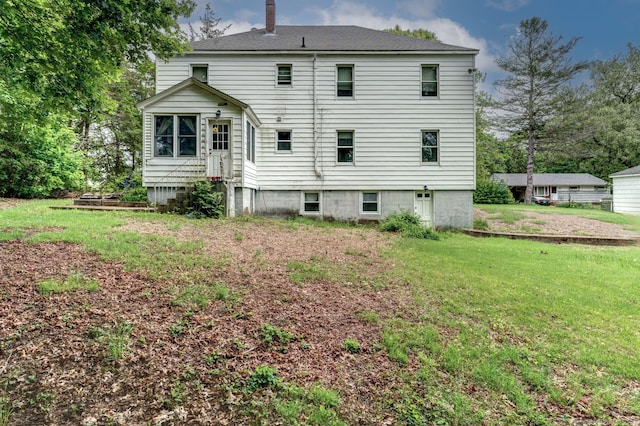 9 Jennings St, Griswold, CT 06351 - back of property featuring a lawn and a chimney