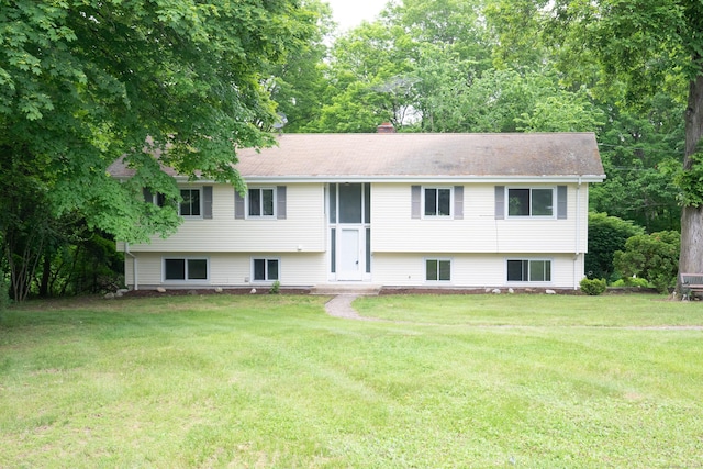 21 Elizabeth St, Trumbull, CT 06611 - view of front of property with a front lawn and a chimney