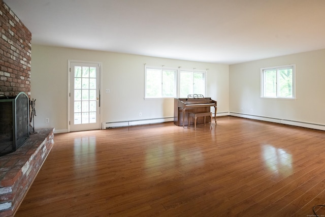 21 Elizabeth St, Trumbull, CT 06611 - living room with a brick fireplace, wood finished floors, baseboard heating, and baseboards
