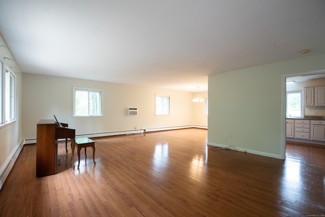 21 Elizabeth St, Trumbull, CT 06611 - living room with a chandelier, a wall mounted air conditioner, wood finished floors, a baseboard heating unit, and baseboards
