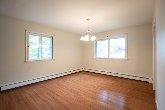 21 Elizabeth St, Trumbull, CT 06611 - unfurnished room featuring wood finished floors, a chandelier, and baseboard heating