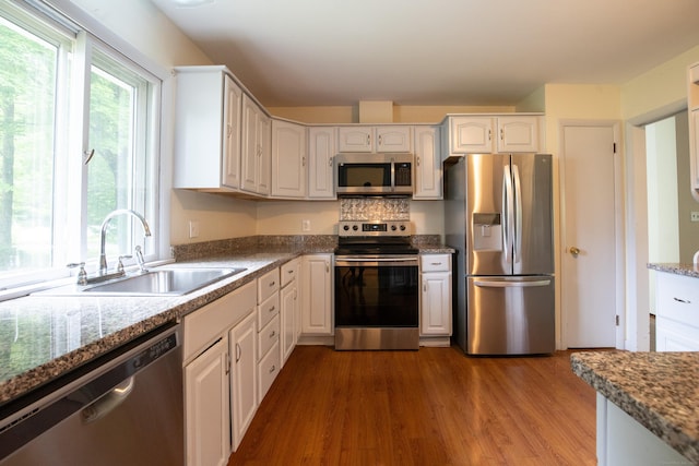 21 Elizabeth St, Trumbull, CT 06611 - kitchen featuring stainless steel appliances, a sink, healthy amount of natural light, and wood finished floors