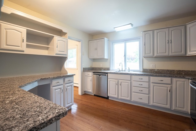 21 Elizabeth St, Trumbull, CT 06611 - kitchen with dishwasher, a sink, wood finished floors, and dark stone counters