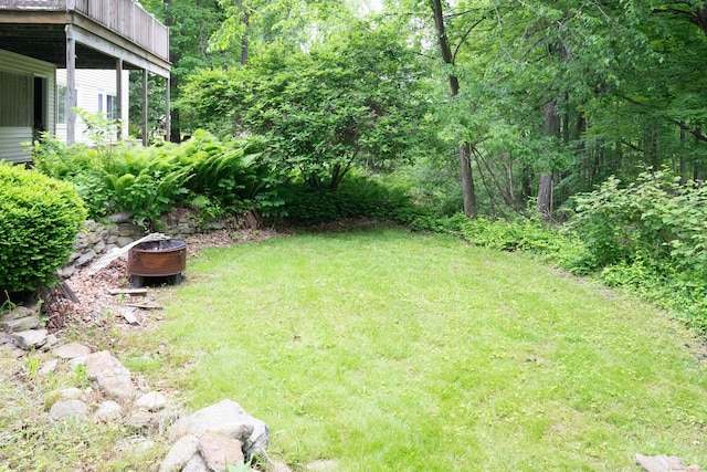 21 Elizabeth St, Trumbull, CT 06611 - view of grassy yard featuring an outdoor fire pit