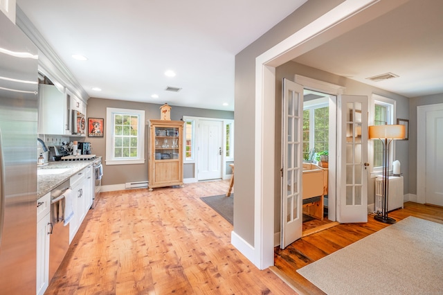 23 Goodsell Hill Rd, Redding, CT 06896 - kitchen featuring stainless steel appliances, a baseboard radiator, white cabinetry, light wood finished floors, and recessed lighting