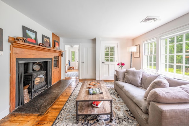 23 Goodsell Hill Rd, Redding, CT 06896 - living room with a wood stove and wood finished floors