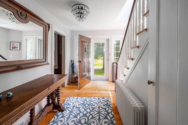 23 Goodsell Hill Rd, Redding, CT 06896 - foyer with radiator, stairway, and wood-type flooring