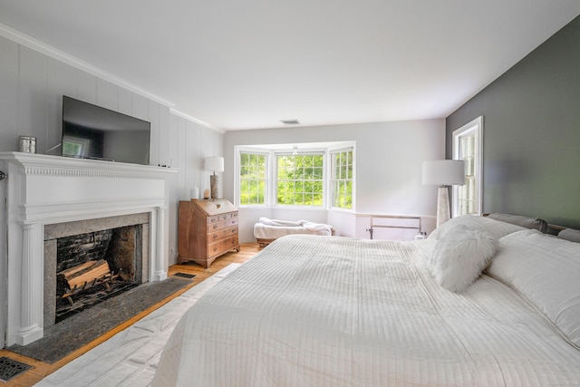 23 Goodsell Hill Rd, Redding, CT 06896 - bedroom featuring ornamental molding, wood finished floors, and a fireplace