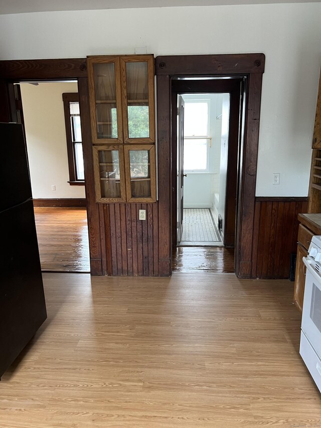 868 Elm St, New Haven, CT 06511 - hallway with light wood-style floors, a wainscoted wall, and wooden walls