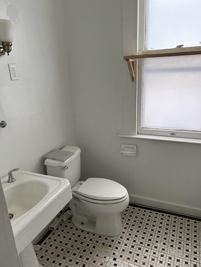 868 Elm St, New Haven, CT 06511 - half bath featuring toilet and tile patterned flooring