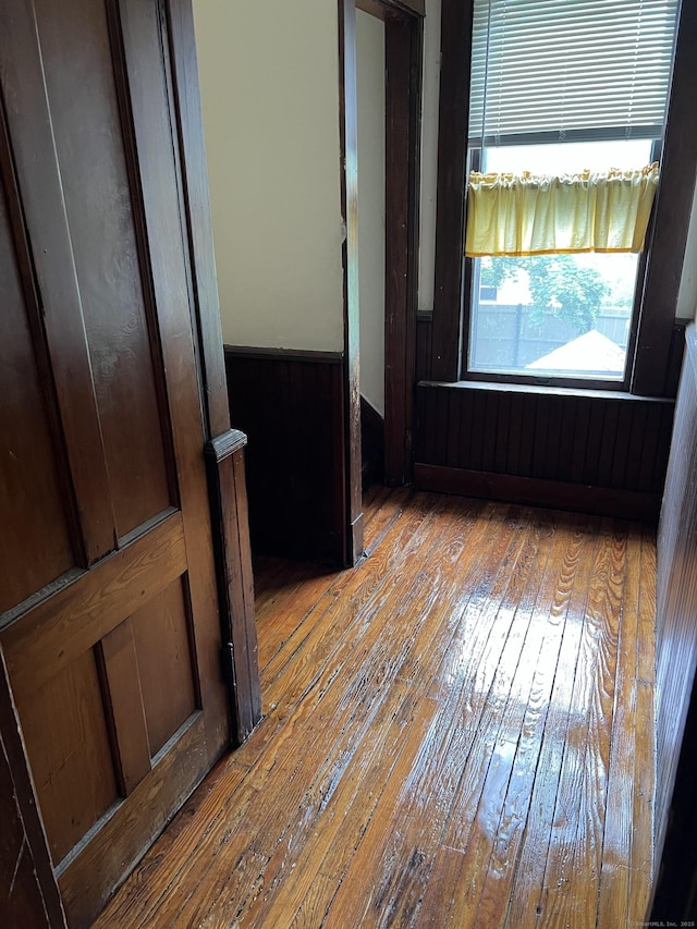 868 Elm St, New Haven, CT 06511 - spare room with wood-type flooring, a wainscoted wall, and wooden walls