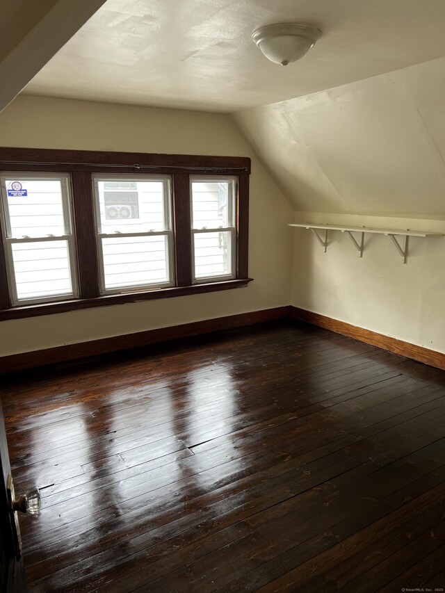 868 Elm St, New Haven, CT 06511 - bonus room featuring vaulted ceiling, dark wood-style floors, and baseboards