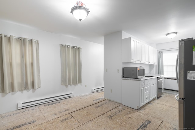 510 S St S, Bristol, CT 06010 - kitchen with a baseboard radiator, appliances with stainless steel finishes, white cabinets, and light countertops
