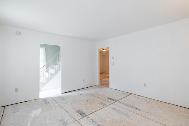 510 S St S, Bristol, CT 06010 - empty room with stairs and a baseboard heating unit