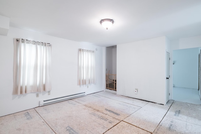 510 S St S, Bristol, CT 06010 - spare room featuring a baseboard heating unit and healthy amount of natural light