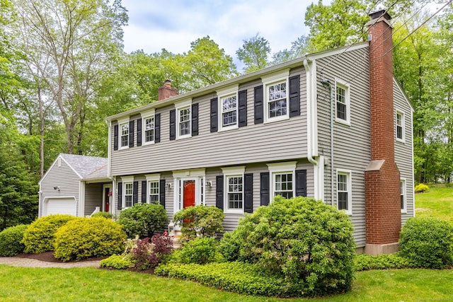 16 Darley Dr, Hamden, CT 06518 - colonial house with a chimney, a garage, and a front yard