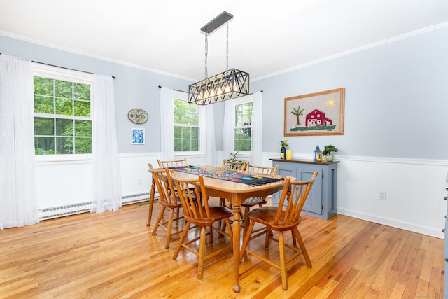 16 Darley Dr, Hamden, CT 06518 - dining space featuring light wood-type flooring, crown molding, wainscoting, and baseboard heating