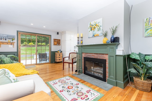 16 Darley Dr, Hamden, CT 06518 - living area with a brick fireplace, light wood-style flooring, and recessed lighting