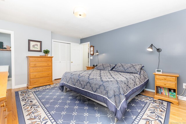 16 Darley Dr, Hamden, CT 06518 - bedroom featuring a closet, wood finished floors, and baseboards