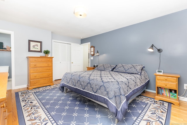 16 Darley Dr, Hamden, CT 06518 - bedroom featuring a closet, wood finished floors, and baseboards