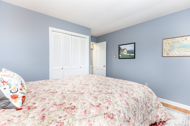 16 Darley Dr, Hamden, CT 06518 - bedroom featuring wood finished floors, a closet, and baseboards
