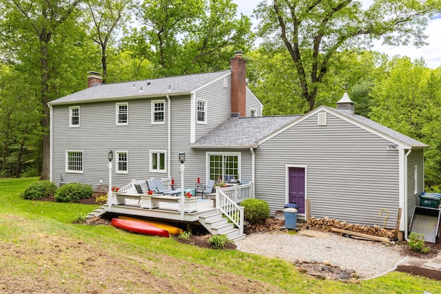 16 Darley Dr, Hamden, CT 06518 - rear view of property with a chimney, a wooden deck, a lawn, a shingled roof, and view of scattered trees