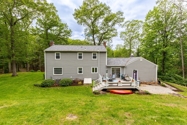 16 Darley Dr, Hamden, CT 06518 - back of property with a chimney, a wooden deck, and a yard