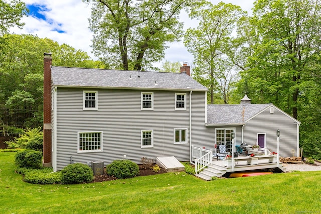 16 Darley Dr, Hamden, CT 06518 - rear view of house with a chimney, a deck, a lawn, and a shingled roof