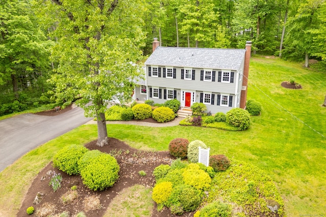 16 Darley Dr, Hamden, CT 06518 - colonial inspired home with a chimney, a front lawn, and entry steps