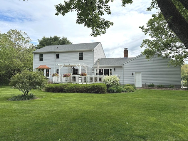 16 Jeremy River Dr, Colchester, CT 06415 - back of house featuring a pergola, a yard, and a chimney