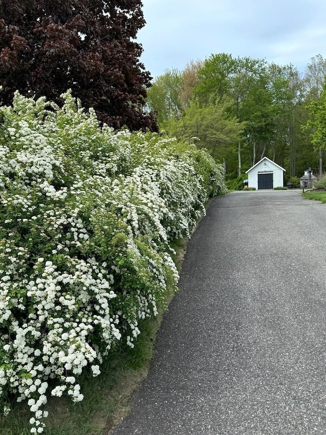 16 Jeremy River Dr, Colchester, CT 06415 - view of property exterior with a garage and an outdoor structure