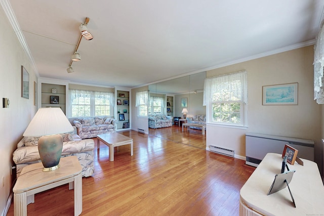 54 Flax Hill Rd, Brookfield, CT 06804 - living area featuring a baseboard heating unit, light wood-style floors, crown molding, baseboards, and built in features