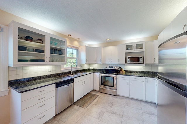 54 Flax Hill Rd, Brookfield, CT 06804 - kitchen featuring appliances with stainless steel finishes, a sink, backsplash, and dark stone countertops