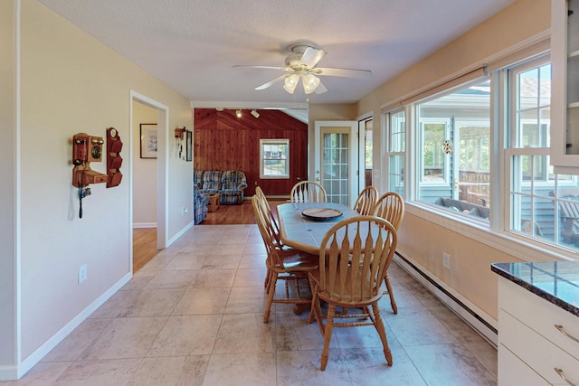 54 Flax Hill Rd, Brookfield, CT 06804 - dining area featuring baseboard heating, a ceiling fan, wood walls, and baseboards