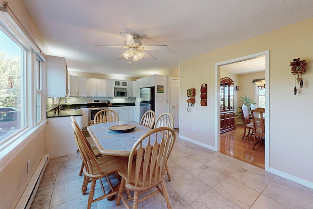 54 Flax Hill Rd, Brookfield, CT 06804 - dining space featuring baseboard heating, ceiling fan, and baseboards