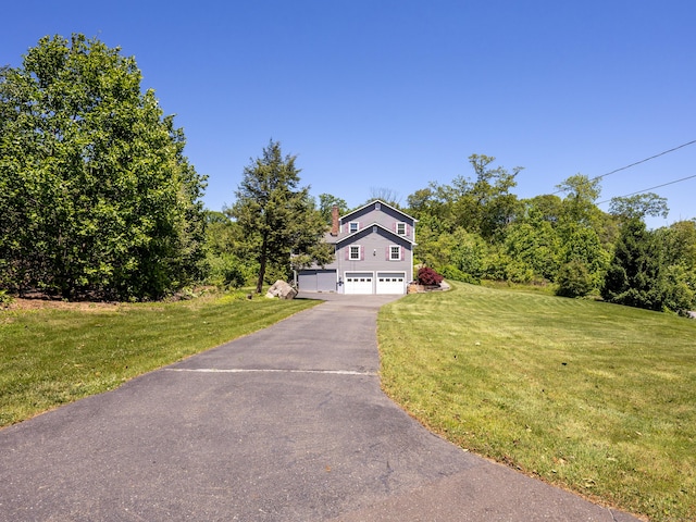 54 Flax Hill Rd, Brookfield, CT 06804 - view of front facade featuring a garage, asphalt driveway, and a front yard
