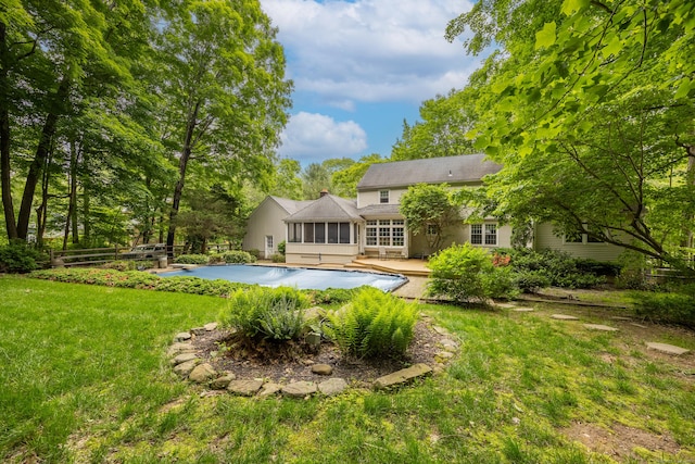 50 Stonehedge Ln S, Guilford, CT 06437 - back of property featuring a sunroom, an outdoor pool, and a patio