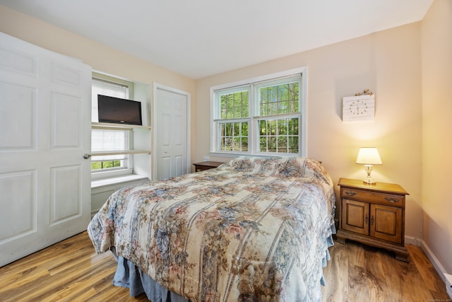 50 Stonehedge Ln S, Guilford, CT 06437 - bedroom featuring multiple windows, wood finished floors, and baseboards