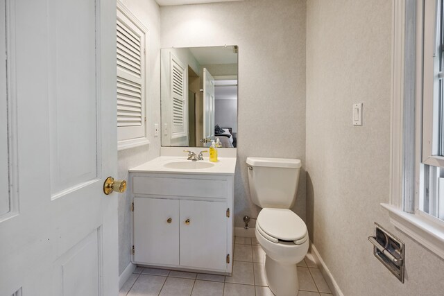 50 Stonehedge Ln S, Guilford, CT 06437 - half bath featuring tile patterned floors, toilet, vanity, and baseboards