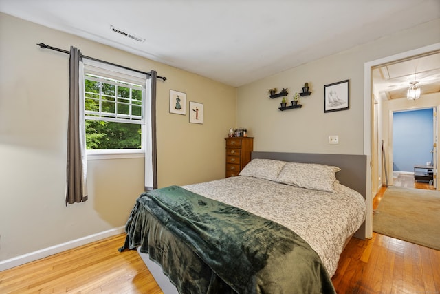 50 Stonehedge Ln S, Guilford, CT 06437 - bedroom featuring attic access, hardwood / wood-style floors, and baseboards