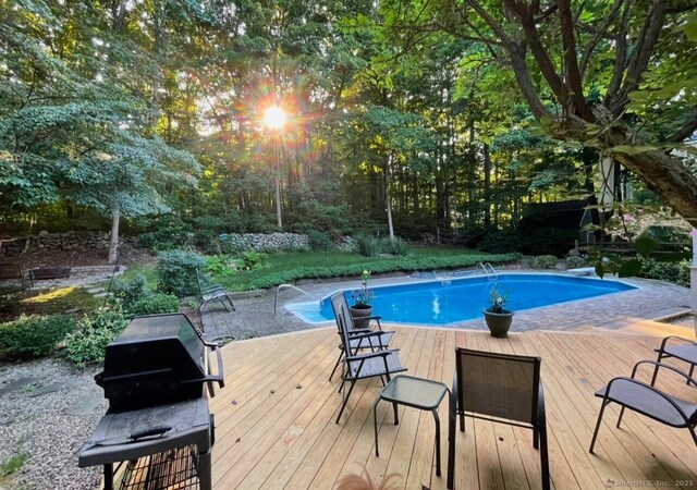 50 Stonehedge Ln S, Guilford, CT 06437 - outdoor pool featuring a wooden deck, a grill, and a diving board