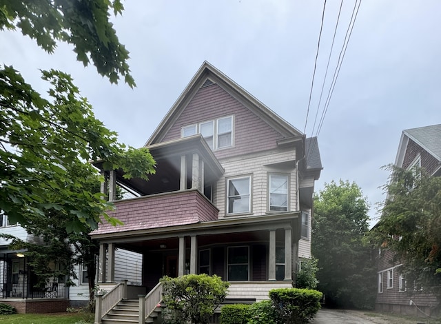 96 Hubinger St, New Haven, CT 06511 - view of front of property featuring a porch, stairway, and a balcony