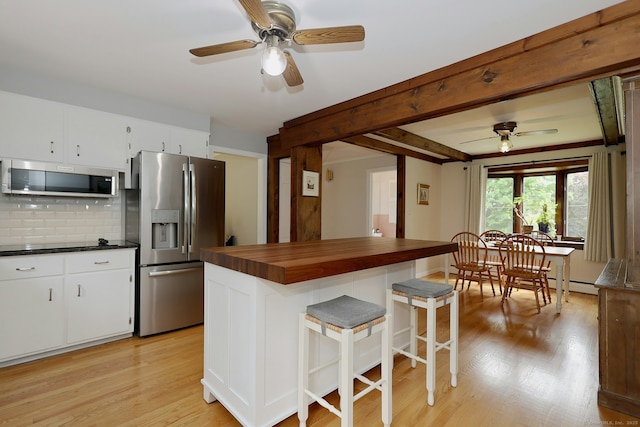 33 Preston Rd, Trumbull, CT 06611 - kitchen with stainless steel appliances, a ceiling fan, wooden counters, backsplash, and light wood-style flooring