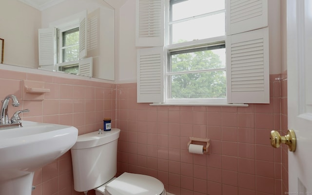 33 Preston Rd, Trumbull, CT 06611 - bathroom with toilet, tile walls, a sink, and a wainscoted wall