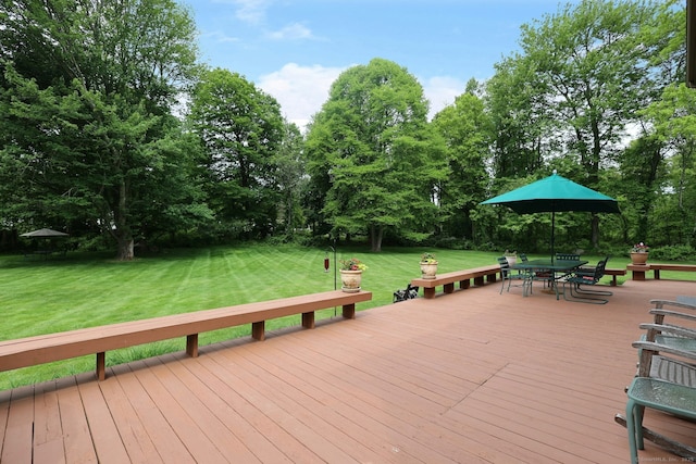 33 Preston Rd, Trumbull, CT 06611 - wooden deck with outdoor dining area, a lawn, and view of wooded area